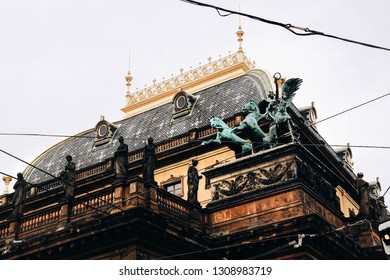 Prague, Czech Republic, Europe. National Theatre building foggy winter morning. Fragment of the roof with sculptures and statues 