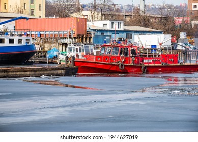 Prague, Czech Republic - February 18, 2021. Red Boat Mistral Breaking Ice In Creek Of Cisarska Louka