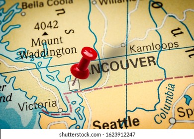 PRAGUE, CZECH REPUBLIC - JANUARY 12, 2019: Red thumbtack in a map. Pushpin pointing at Vancouver city in Canada.