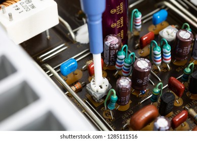 Prague, CZECH REPUBLIC - JANUARY 14, 2019: Ceramic Screwdriver Is ESD Non-conducting, Non-metallic And Non-magnetic For Adjusting Trimmers, In Front Of PCB Audio Amplifier Board