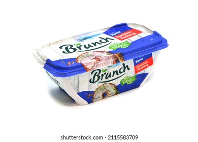 PRAGUE, CZECH REPUBLIC – JANUARY 28, 2022: Brunch Spread, Creamy Cheese With Milk. Packed In The Tub Container Placed On A White Background.