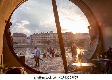 Prague, Czech Republic, June 13, 2020: Prague Vltava Waterfront, People Enjoying Sunset Time At The Quay