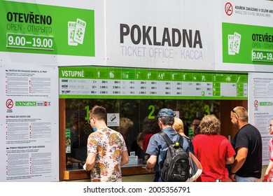 Prague, Czech Republic - March 20, 2021: Group of people waiting in queue at cash ticket booking office, checkout line in Prague Zoo.