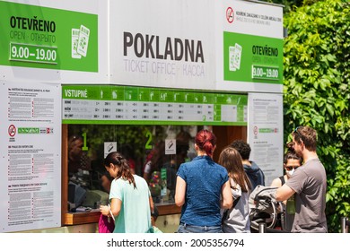 Prague, Czech Republic - March 20, 2021: Group of people waiting in queue at cash ticket booking office, checkout line in Prague Zoo.