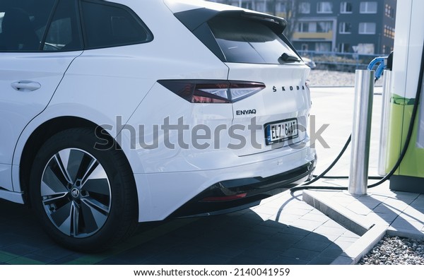PRAGUE, CZECH REPUBLIC - March 26, 2022:\
Charging a electric vehicle (NEW SKODA ENYAQ) at a DC charger\
.Electric mobility environment\
friendly