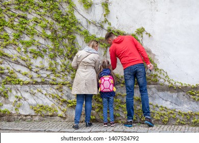 PRAGUE, CZECH REPUBLIC - MAY 2, 2019: Family Exploring City Of Prague, Tourists Wandering Around The City