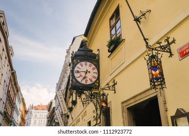 Prague, Czech Republic - May 22, 2018: Facade Of The Building And Clock Of The Famous And Ancient U Fleku Brewery