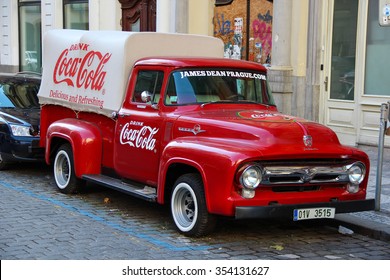 PRAGUE, CZECH REPUBLIC - Oct 23 2015: An old renovated red Ford vintage Coca cola truck (pickup) in a parking lot., Czech Republic, on Oct 23, 2015.