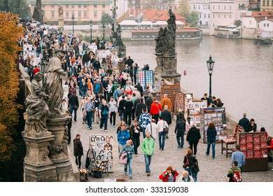 Prague, Czech Republic - October 10, 2014: People Walking On Charles Bridge In Prague, Czech Republic