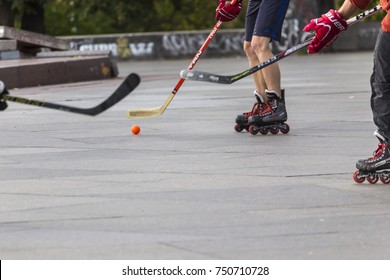 PRAGUE, CZECH REPUBLIC - OCTOBER 12, 2017 - Low angle view of people playing street hockey in Letna Park in Prague, Czech Republic.