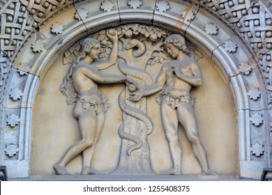 PRAGUE, CZECH REPUBLIC - OCTOBER 17, 2018: The relief of Adam and Eva (Paradise Lost) on the portal of the church kostel Svatého Cyrila Metodeje by Václav Levý (1867 - 1869).