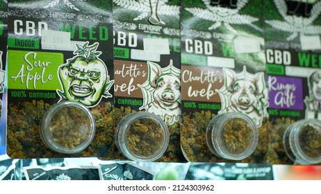 PRAGUE, CZECH REPUBLIC, SEPTEMBER 25, 2021: Cannabis Smoking Cigarettes Joint Bud Dried Shop Medicinal Hemp Harvested Glass Seeds Sativa Weed Store, Packaged Hemp CBD, Leaf Symbol