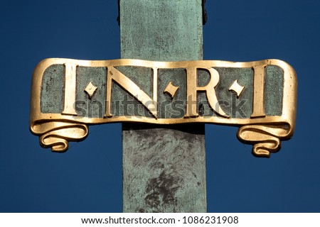 PRAGUE / CZECH REPUBLIC: Sign I N R I (Iesus Nazarenus Rex Iudaeorum) on a religious sculpture on Charles Bridge