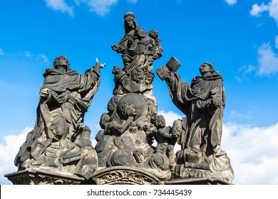 Prague, Czech Republic: Statues of Madonna, Saint Dominic and Thomas Aquinas, outdoor sculptures on the north side of Charles Bridge over the river Vltava.