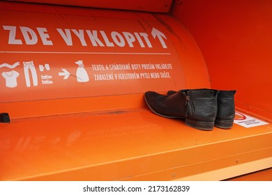 Prague, Czechia - April 15 2021: Container for used clothing and shoes used by charitable organisation and local governments