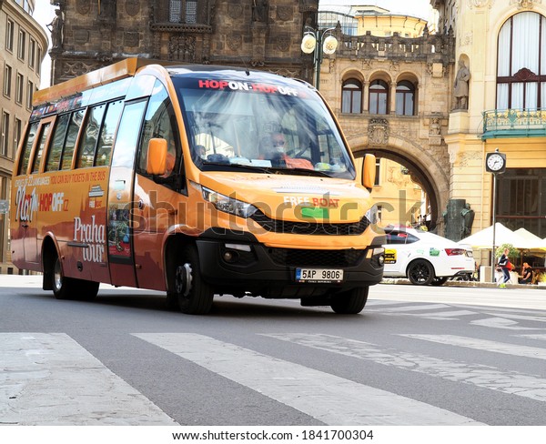 PRAGUE, CZECHIA - Hop on Hop off tourist tour bus\
in centre of the city during ride through Old town at Powder Tower.\
The driver protects himself with facemask, Czech Republic, Europe,\
Sep 7/2020