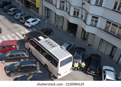 PRAGUE, CZECHIA - Mar 27, 2014: Tour Bus Is Abke To Pass After Ford Mondeo Station Wagon Moves Into Legal Parking Place On Sidewalk.  Local News.