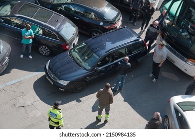 PRAGUE, CZECHIA - Mar 27, 2014: Driver Of Illegally Double-parked Ford Mondeo Station Wagon  Blocking Traffic On Stepanska Street Arrives To Move His Car. Local News.