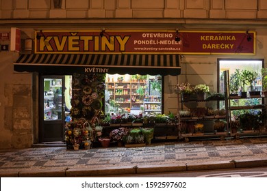 PRAGUE, CZECHIA - NOVEMBER 3, 2019: Florist Boutique In Prague, Called In Czech Kvetiny, Meaning Flower Shop, Open Late At Night In A Dark Street With Windows Open.

