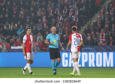 PRAGUE, CZECHIA - OCTOBER 23, 2019: Referee Bobby Madden (SCO) Shows Yellow Card To Lukas Masopust During The UEFA Champions League Game Barcelona V Slavia Praha At Eden Arena In Prague