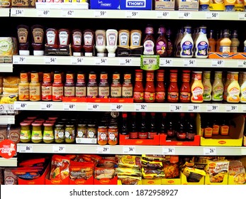 PRAGUE, CZECHIA - A Supermarket fully equiped shelf with ketchups, mayonnaise, mustard, other barbecue condiments and ready to cook food products, Europe Dec 12 2020