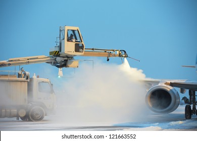 PRAGUE - DECEMBER 11: Ground crew of Czech Airlines Handling provides de-icing. They are spraying the aircraft, which prevents the occurrence of frost on December 11, 2012 in Prague, Czech Republic.