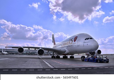 PRAGUE - MAY 6, 2016: Emirates airlines Airbus A380 docked at VACLAV HAVEL Airport, Czech Republic, to ready to take off - push back on runway. - Shutterstock ID 565497601