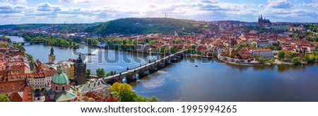 Prague scenic spring aerial view of the Prague Old Town pier architecture Charles Bridge over Vltava river in Prague, Czechia. Old Town of Prague with the Castle in the background, Czech Republic.