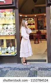 Prague/Czech Republic- 09/18/2017: A Beautiful, Young Store Clerk Awaits Foot Traffic In Prague's Old Town. 