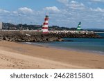 Praia da Batata beach of Ponta da Piedade in the Algarve, Portugal. Natural features, cliffs and limestone formations. Cais da Solaria. Solaria Pier.