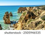 Praia da Marinha Beach among rock islets and cliffs seen from Seven Hanging Valleys Trail, Percurso dos Sete Vales Suspensos. Algarve, Portugal