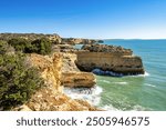 Praia da Marinha Beach among rock islets and cliffs seen from Seven Hanging Valleys Trail, Percurso dos Sete Vales Suspensos. Algarve, Portugal