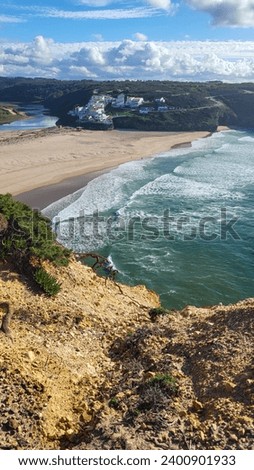 Praia De Odeceixe Mar Beach With Golden Sand, Atlantic Ocean, River Bend and White Houses of Odeceixe Village. Rota Vicentina Coast, Odemira, Portugal. Hiking Rota Vicentina the Fisherman's Trail