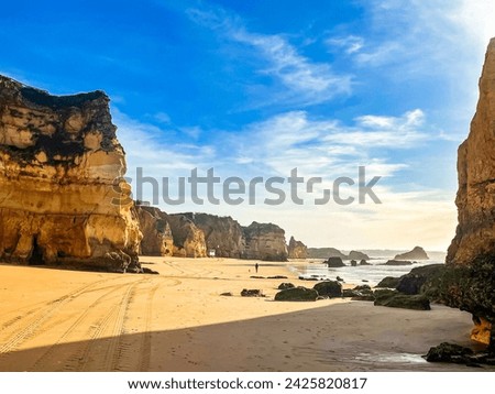 Praia do submarino, Alvor, Portugal, Algarve. Rocks, rocky shore, yellow rocks, coquina, beautiful coastline