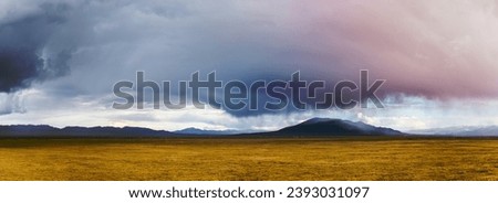 prairie landscape before the storm, panoramic view of autumn pasture in qinghai province, China