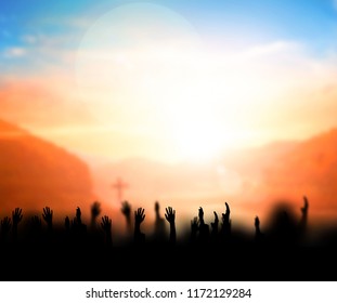 Praise and worship concept:Silhouette of Christian prayers raising hand while praying to the Jesus