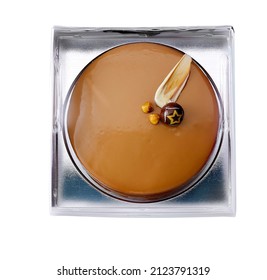 Praline Cake In A Plastic Tray Isolated On White