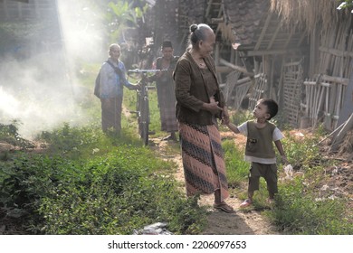 Prambanan, Yogyakarta, Indonesia, September 24 2022, Old Lady And Little Boy Morning Activities In Village 