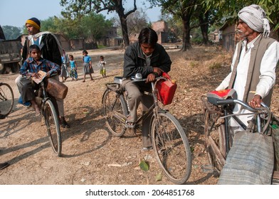 Pratapgarh, Uttar Pradesh, India-Feb 6 2012: Villagers With Kerosene Container And Ration Card Going  To Government Kerosene Shop. Villagers Travelling On Bicycle.