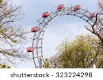 Prater Wheel, Vienna, Austria among spring green trees