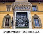 Prato, Italy, pedestal with relief on the old monument by Francesco Datini