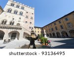 Prato (Tuscany, Italy), historic square called Piazza del Comune with the medieval Palazzo Pretorio and the statue of Francesco Di Marco Datini, made by Antonio Garella at the end of 19th century.