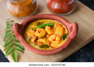 Prawn mango curry. Kerala food Chemmeen Manga shrimp in coconut milk. Spicy fish curry popular Indian seafood served as side dish for rice. Also popular in Goa Tamil Nadu Bengal Sri Lankan
