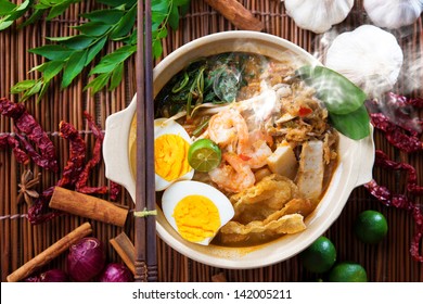 Prawn Mee, Prawn Noodles. Popular Malaysian Food Spicy Fresh Cooked Har Mee In Clay Pot With Hot Steam. Asian Cuisine.