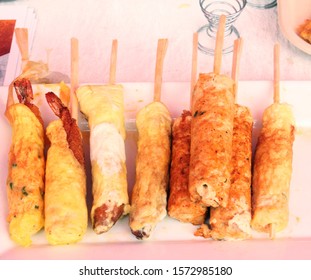 Prawns/Shrimp Stuffed Egg Roll Made Using Roll Maker, For A Easy Hold A Stick Is Stuffed Into Its Center. Other Words Using Sausage Hot Dog Roll Maker.