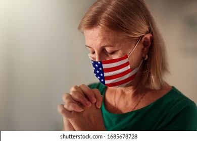 Pray For America. American Woman In Face Mask With Flag Praying. Senior Patient In Hospital Chapel Or Church During Coronavirus Outbreak In USA. Virus Pandemic. People Worship. Nurse Saying A Prayer.