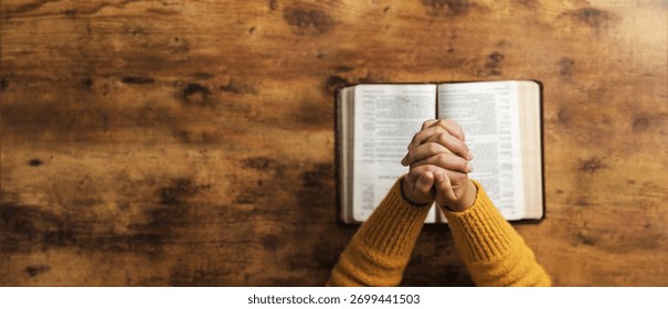 Pray to God with the holy scriptures. Prayer concept asking for a higher power for praise or hope and Christian Faith Spirituality and Religion. copy space background