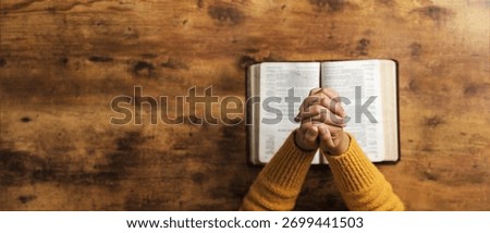 Pray to God with the holy scriptures. Prayer concept asking for a higher power for praise or hope and Christian Faith Spirituality and Religion. copy space background