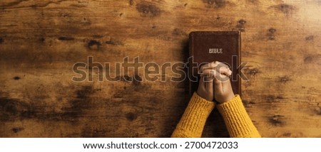 Pray to God with the holy scriptures. Prayer concept asking for a higher power for praise or hope and Christian Faith Spirituality and Religion. copy space background