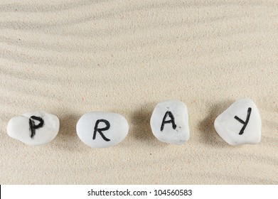 Pray Word On Group Of Stones With Sand Background